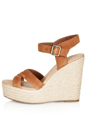Whispered Cross Over Wedges - predominant colour: tan; occasions: casual, holiday; material: suede; heel height: high; embellishment: buckles; ankle detail: ankle strap; heel: wedge; toe: open toe/peeptoe; style: standard; finish: plain; pattern: plain; season: s/s 2013