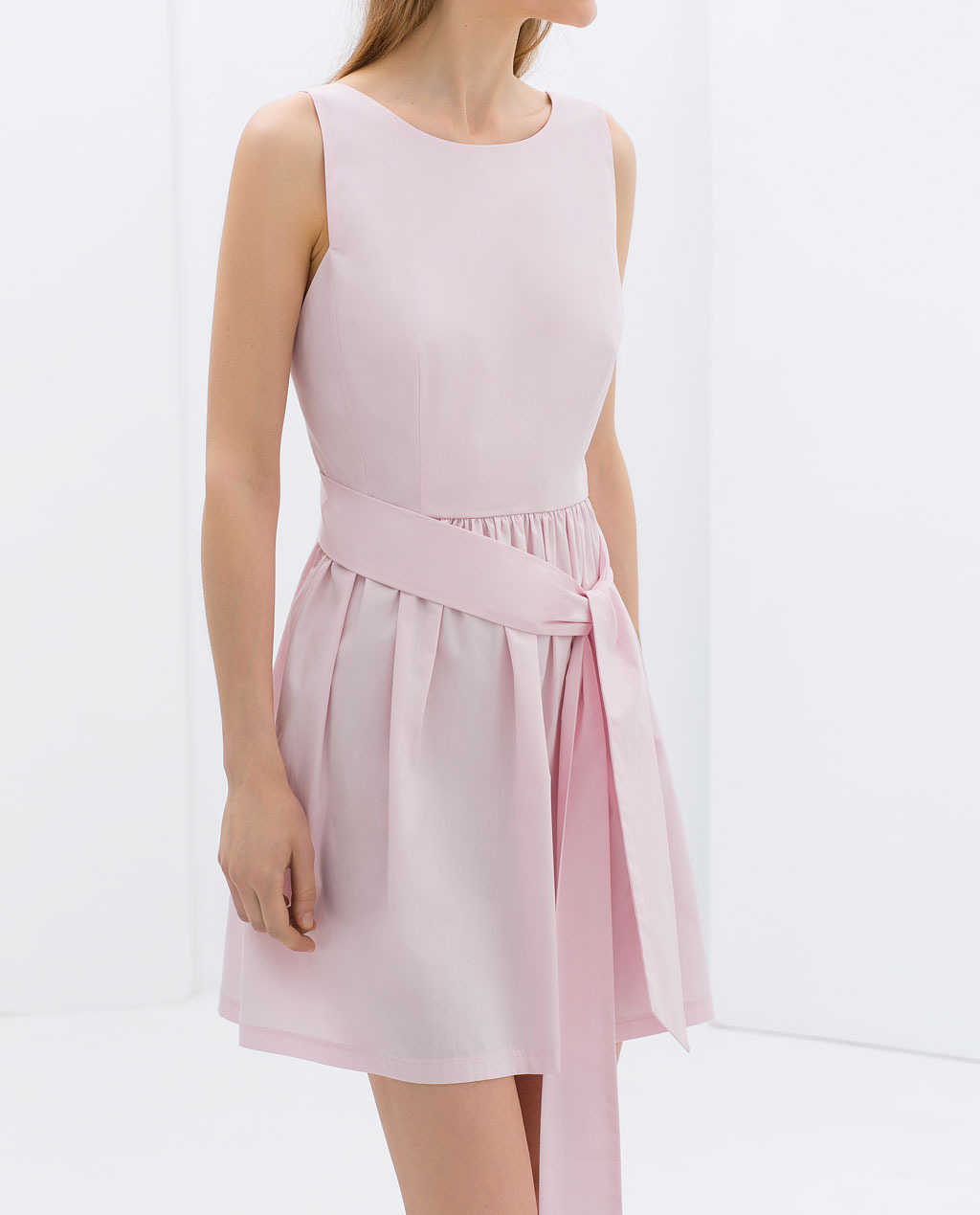 Poplin Dress With Bow At The Back - length: mid thigh; neckline: round neck; pattern: plain; sleeve style: sleeveless; back detail: back revealing; waist detail: belted waist/tie at waist/drawstring; predominant colour: blush; occasions: casual, evening, holiday, creative work; fit: fitted at waist & bust; style: fit & flare; fibres: cotton - 100%; sleeve length: sleeveless; texture group: cotton feel fabrics; hip detail: ruffles/tiers/tie detail at hip; pattern type: fabric; trends: sorbet shades; season: s/s 2014