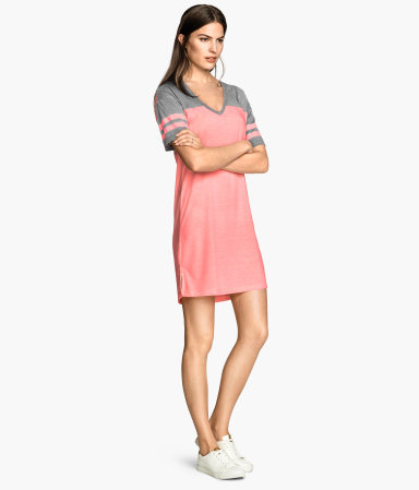 T Shirt Dress - style: t-shirt; length: mid thigh; neckline: v-neck; fit: loose; predominant colour: pink; secondary colour: mid grey; occasions: casual, holiday; fibres: cotton - 100%; sleeve length: short sleeve; sleeve style: standard; pattern type: fabric; pattern size: light/subtle; pattern: colourblock; texture group: jersey - stretchy/drapey; season: s/s 2015; wardrobe: highlight