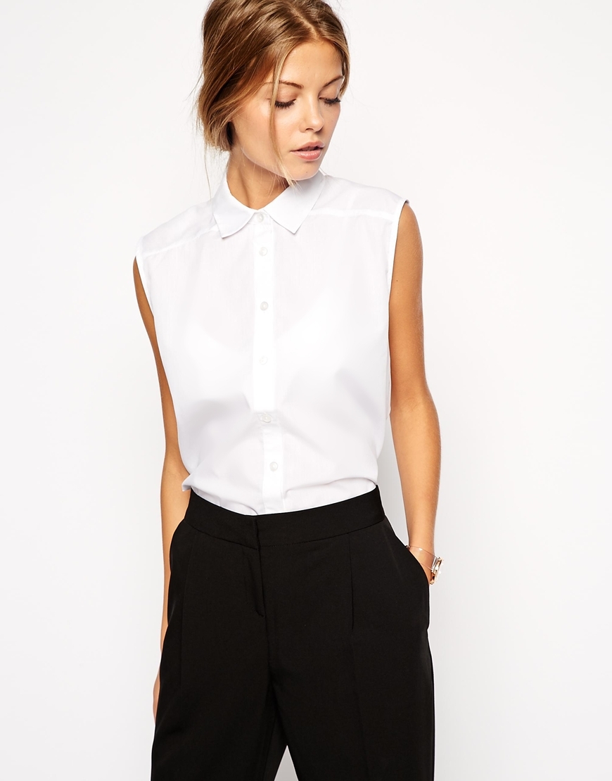 Sleeveless White Shirt White - neckline: shirt collar/peter pan/zip with opening; pattern: plain; sleeve style: sleeveless; style: shirt; predominant colour: white; occasions: casual, work, creative work; length: standard; fibres: cotton - mix; fit: straight cut; sleeve length: sleeveless; texture group: cotton feel fabrics; season: s/s 2015