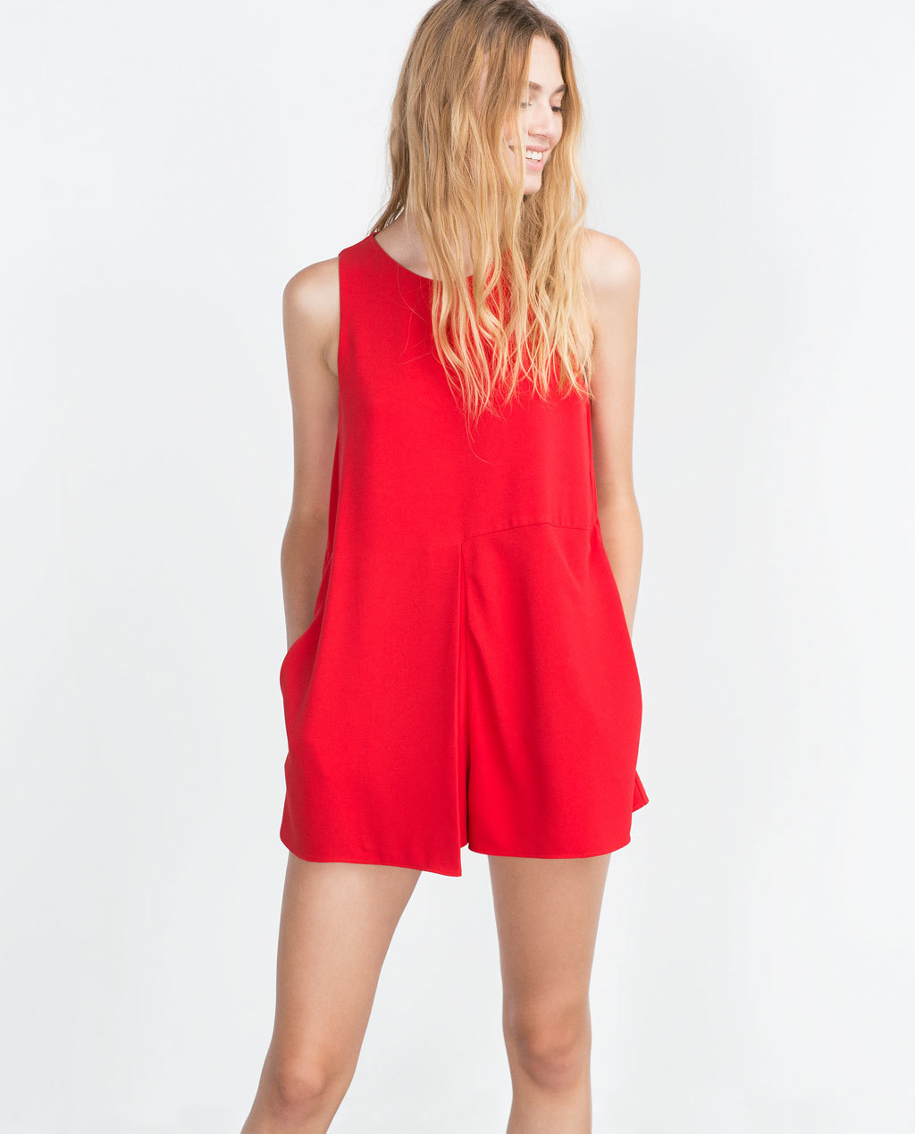 Front Pleat Jumpsuit - neckline: round neck; fit: loose; pattern: plain; sleeve style: sleeveless; length: short shorts; predominant colour: true red; occasions: casual, evening; fibres: polyester/polyamide - 100%; sleeve length: sleeveless; texture group: crepes; style: playsuit; pattern type: fabric; season: a/w 2015; wardrobe: highlight