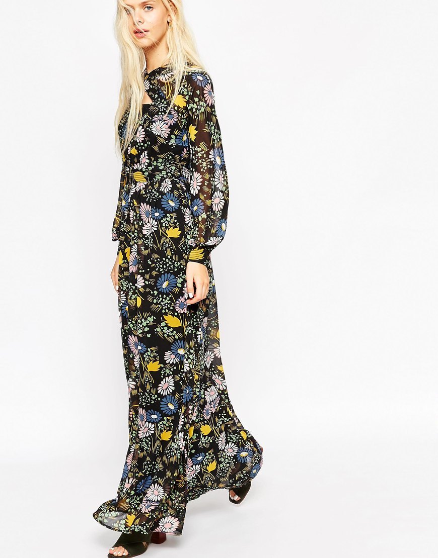 Maxi Dress With Cut Out Detail Black - style: maxi dress; secondary colour: yellow; predominant colour: black; occasions: evening; length: floor length; fit: body skimming; fibres: polyester/polyamide - 100%; neckline: crew; sleeve length: long sleeve; sleeve style: standard; texture group: sheer fabrics/chiffon/organza etc.; pattern type: fabric; pattern: florals; multicoloured: multicoloured; season: a/w 2015