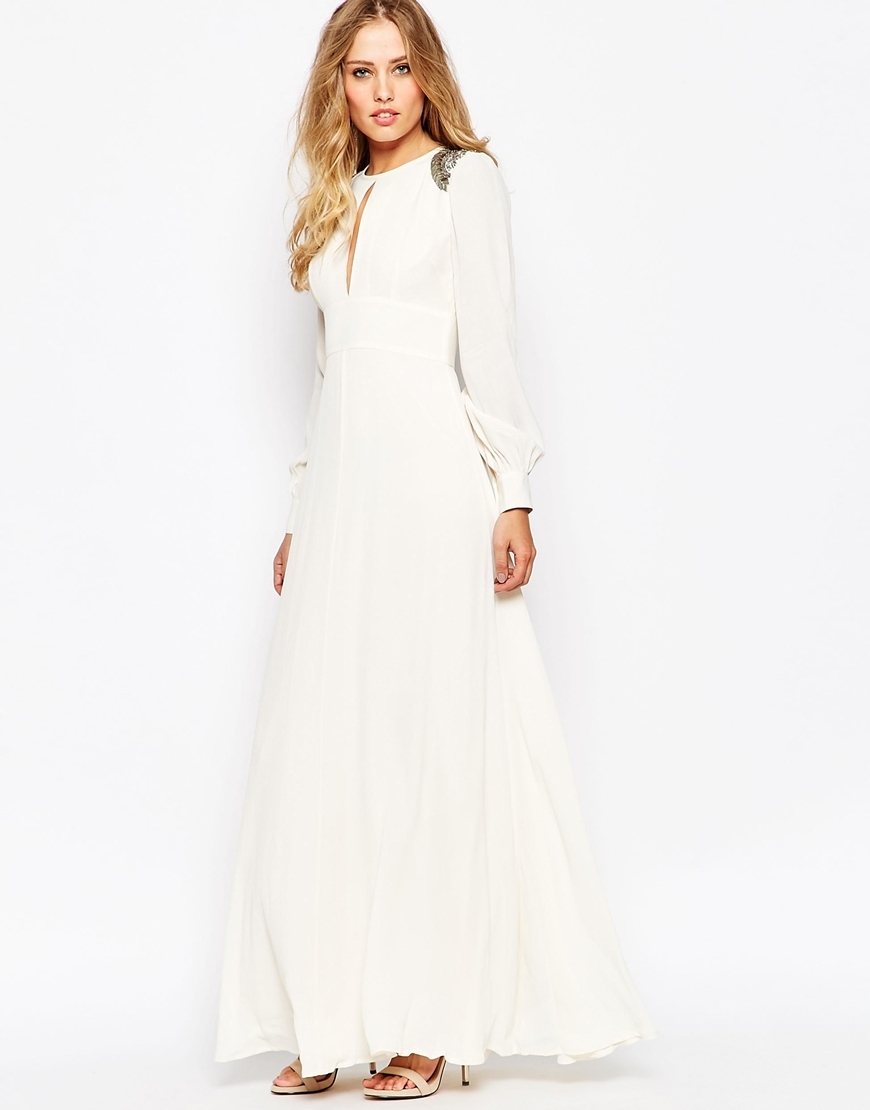 Embellished Shoulder 70s Maxi Dress Cream - pattern: plain; style: maxi dress; predominant colour: ivory/cream; length: floor length; fit: body skimming; neckline: peep hole neckline; fibres: viscose/rayon - 100%; occasions: occasion; hip detail: soft pleats at hip/draping at hip/flared at hip; sleeve length: long sleeve; sleeve style: standard; texture group: crepes; pattern type: fabric; season: a/w 2015