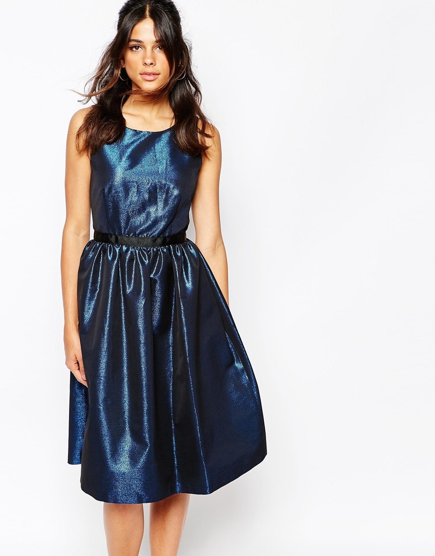 V Back Prom Dress In Blue Metallic Fabric Blue - neckline: round neck; sleeve style: sleeveless; predominant colour: navy; occasions: evening, occasion; length: on the knee; fit: fitted at waist & bust; style: fit & flare; fibres: polyester/polyamide - mix; hip detail: soft pleats at hip/draping at hip/flared at hip; sleeve length: sleeveless; texture group: structured shiny - satin/tafetta/silk etc.; pattern type: fabric; pattern: patterned/print; season: a/w 2015