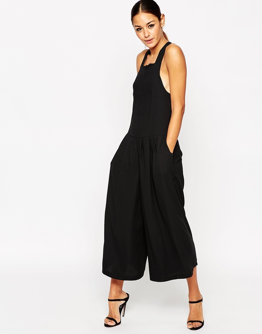 Pinafore Jumpsuit With Culotte Wide Leg Black - sleeve style: standard vest straps/shoulder straps; fit: fitted at waist; pattern: plain; predominant colour: black; occasions: evening; length: calf length; fibres: polyester/polyamide - 100%; sleeve length: sleeveless; texture group: crepes; style: jumpsuit; neckline: low square neck; pattern type: fabric; season: a/w 2015