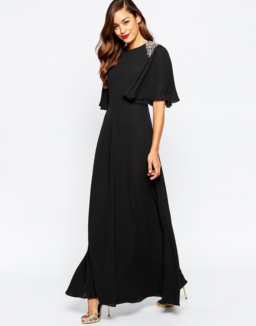 Embellished Shoulder Flutter Sleeve Maxi Dress Black - pattern: plain; style: maxi dress; back detail: low cut/open back; secondary colour: silver; predominant colour: black; length: floor length; fit: body skimming; fibres: polyester/polyamide - 100%; occasions: occasion; sleeve style: cape sleeve; neckline: crew; sleeve length: half sleeve; texture group: crepes; pattern type: fabric; embellishment: beading; season: a/w 2015