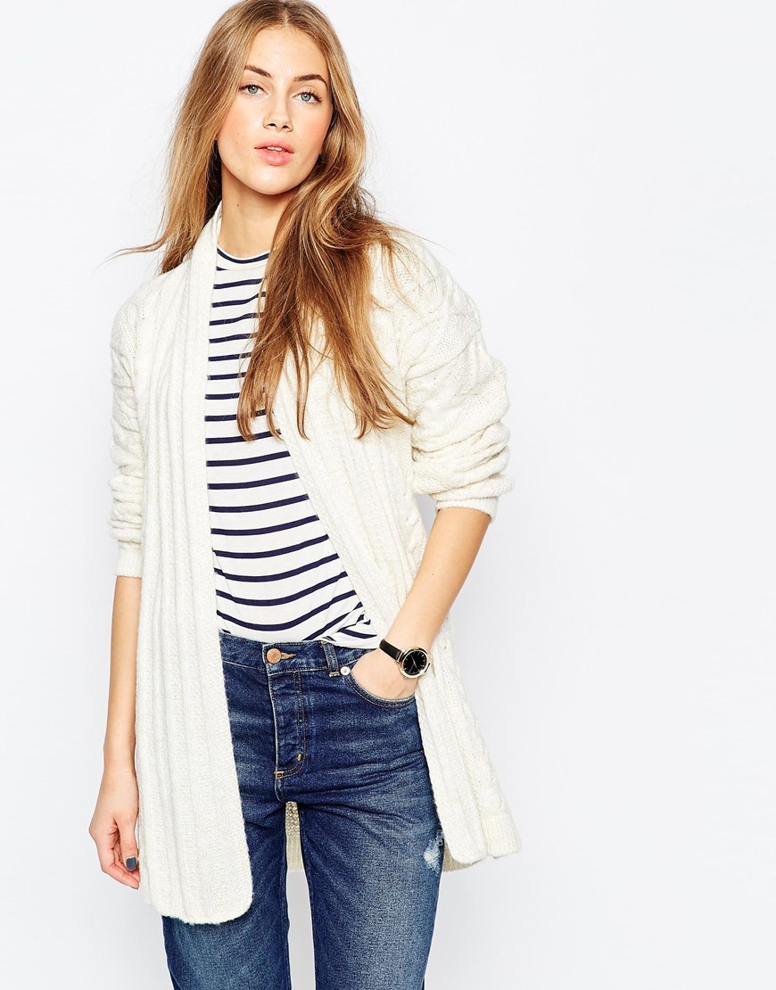 Belted Cardigan In Cable Knit Cream - neckline: shawl; style: bolero/shrug; length: below the bottom; pattern: cable knit; predominant colour: ivory/cream; occasions: casual; fibres: acrylic - mix; fit: loose; waist detail: belted waist/tie at waist/drawstring; sleeve length: long sleeve; sleeve style: standard; texture group: knits/crochet; pattern type: knitted - big stitch; pattern size: standard; season: a/w 2015