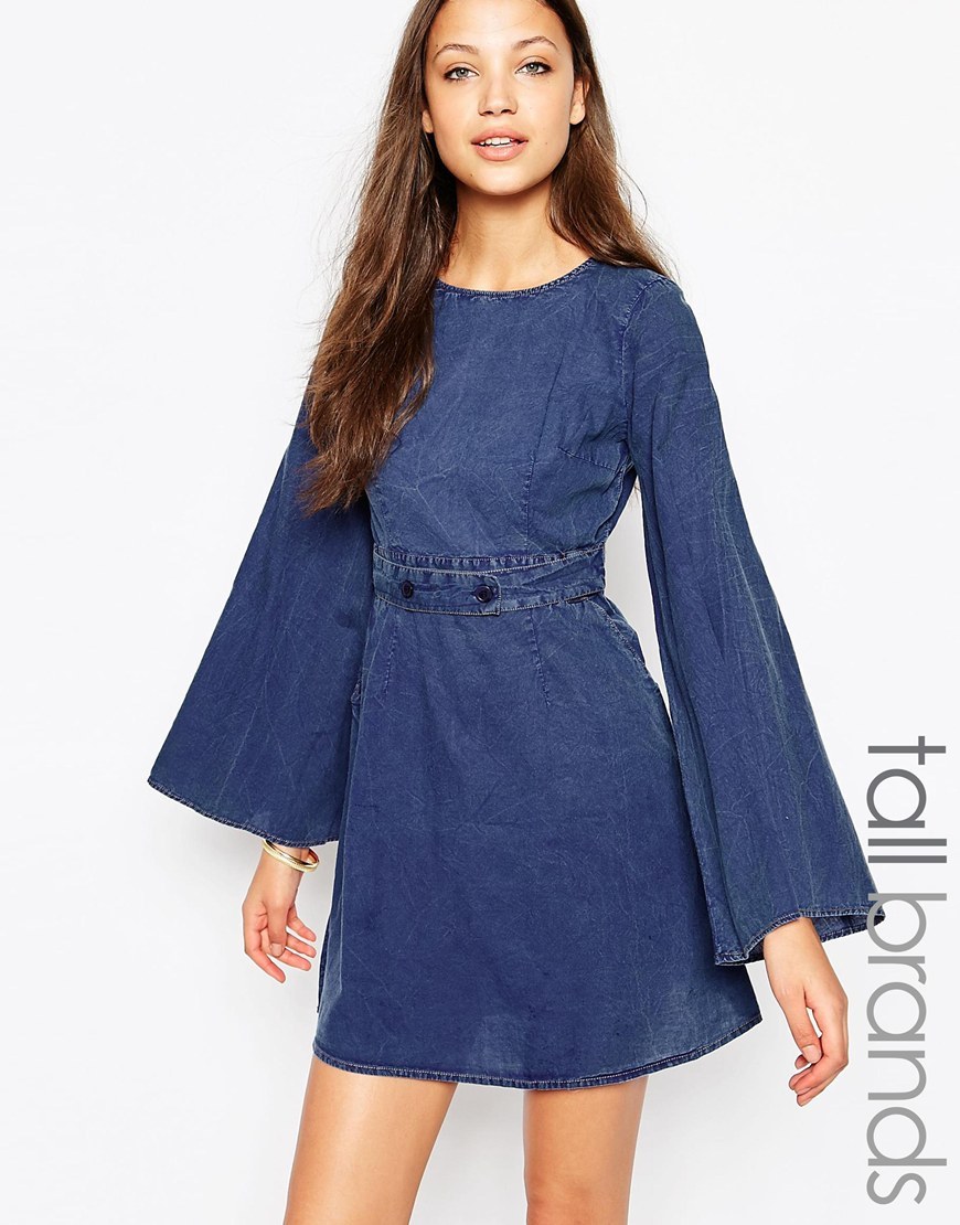 Denim Shift Dress With Buckle Detail Blue - length: mini; sleeve style: angel/waterfall; pattern: plain; waist detail: embellishment at waist/feature waistband; predominant colour: navy; occasions: casual; fit: fitted at waist & bust; style: fit & flare; fibres: cotton - 100%; neckline: crew; sleeve length: long sleeve; texture group: denim; pattern type: fabric; season: a/w 2015