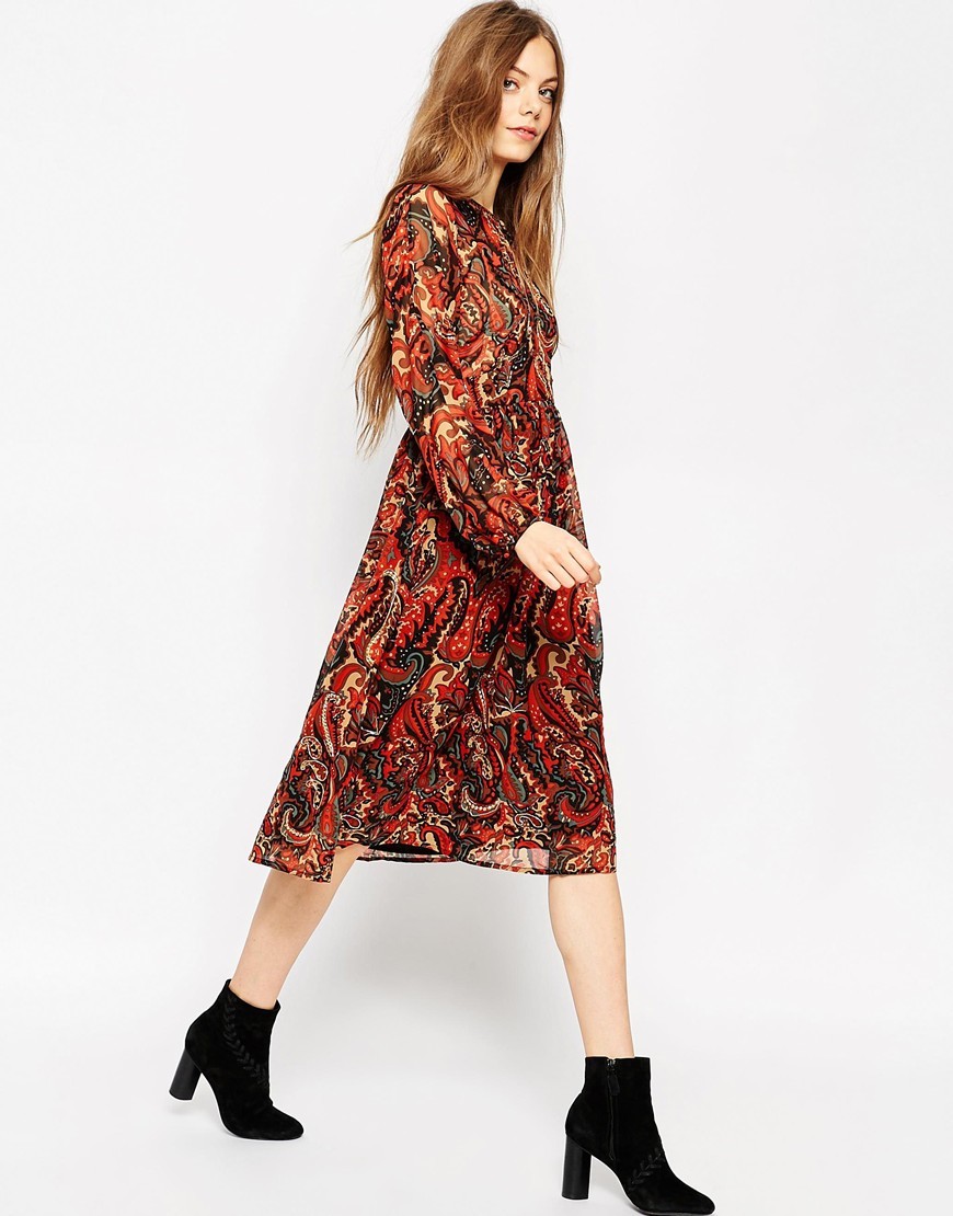 Long Sleeve Midi Dress In Folk Print With Embellishment Multi - style: shift; length: below the knee; sleeve style: bell sleeve; fit: fitted at waist; pattern: paisley; predominant colour: terracotta; secondary colour: black; occasions: casual, creative work; neckline: peep hole neckline; fibres: polyester/polyamide - 100%; sleeve length: long sleeve; texture group: sheer fabrics/chiffon/organza etc.; pattern type: fabric; pattern size: standard; multicoloured: multicoloured; season: a/w 2015