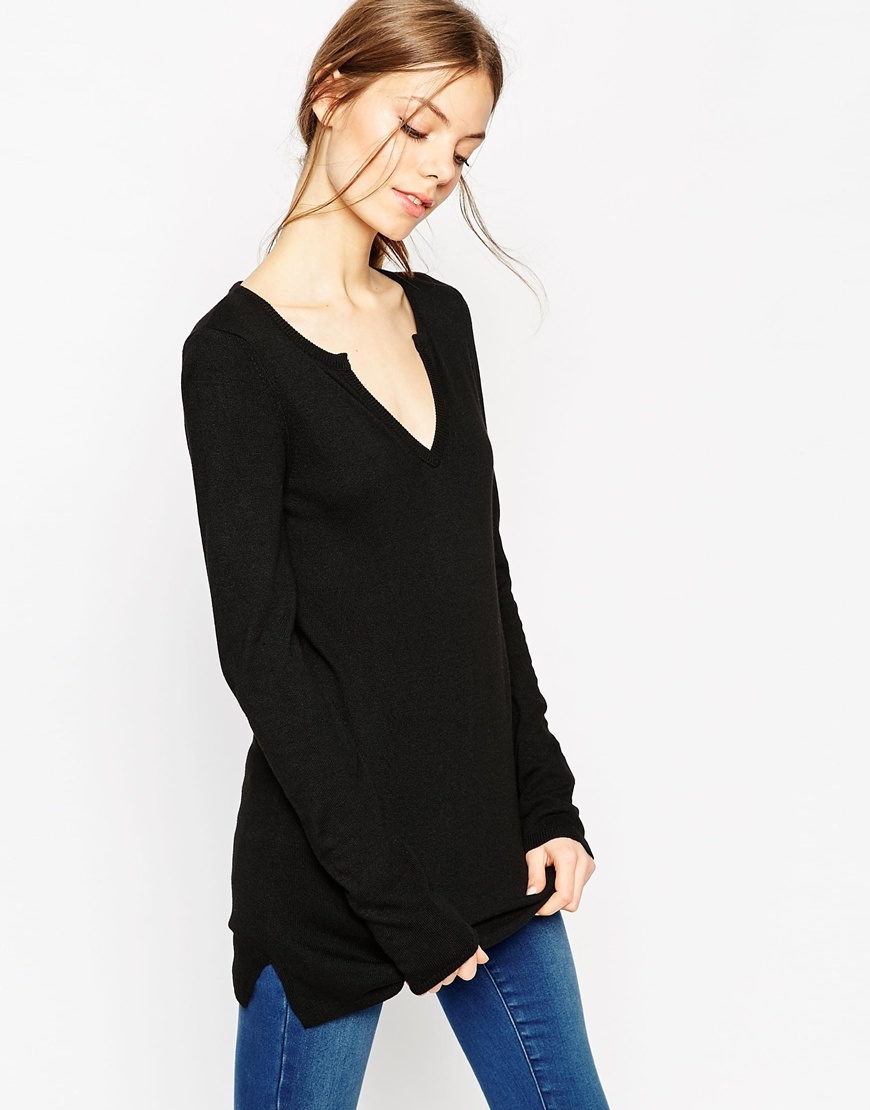 Flared Sleeve Tunic With Deep Notch V Neck In Knit Black - neckline: low v-neck; pattern: plain; length: below the bottom; style: standard; predominant colour: black; occasions: casual, creative work; fibres: wool - mix; fit: standard fit; sleeve length: long sleeve; sleeve style: standard; texture group: knits/crochet; pattern type: knitted - fine stitch; season: a/w 2015