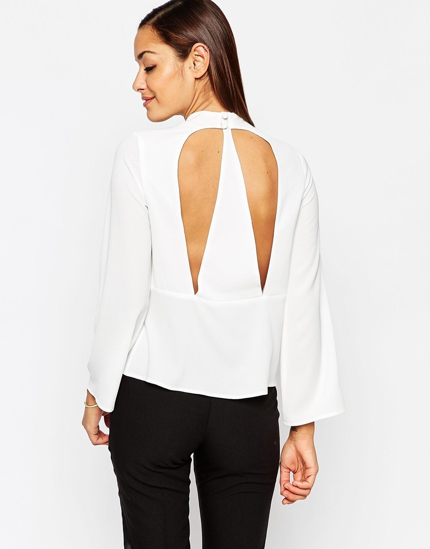 Funnel Neck Top With Open Back Ivory - pattern: plain; neckline: roll neck; predominant colour: white; occasions: evening; length: standard; style: top; fibres: polyester/polyamide - stretch; fit: body skimming; back detail: keyhole/peephole detail at back; sleeve length: long sleeve; sleeve style: standard; pattern type: fabric; texture group: other - light to midweight; season: a/w 2015