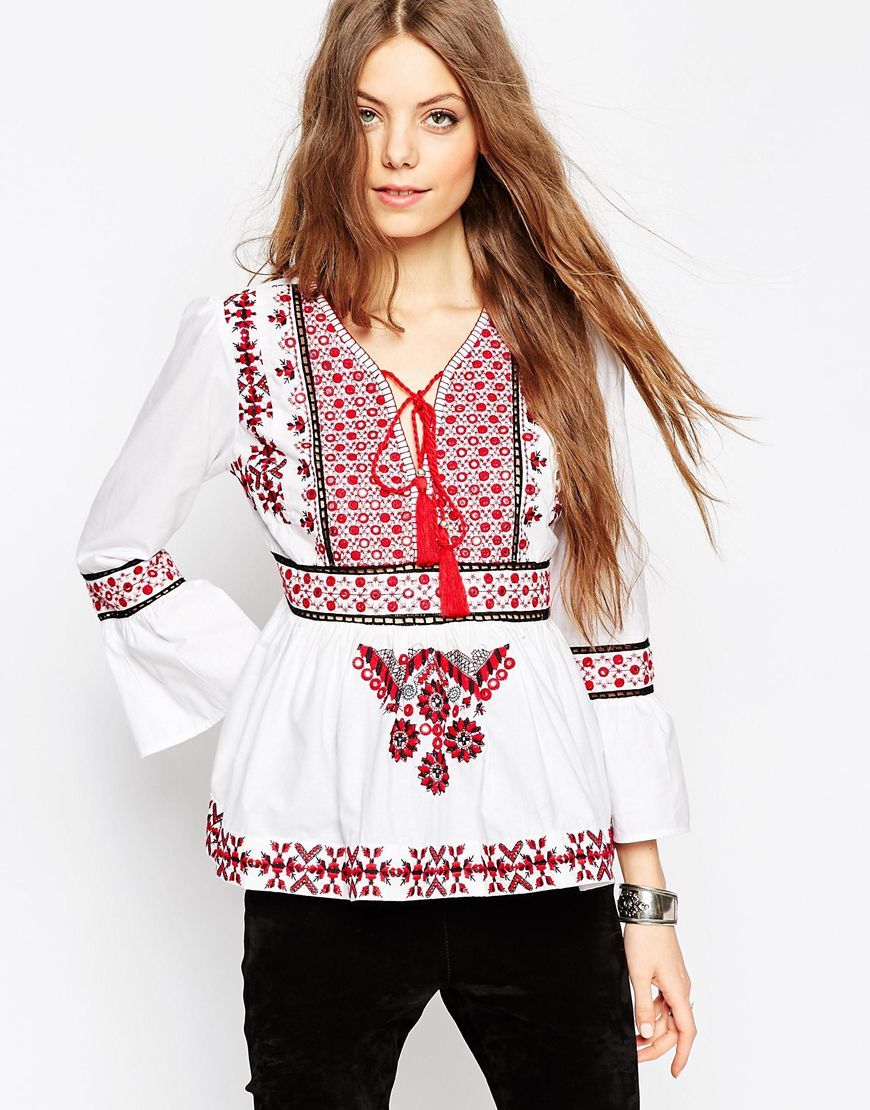 Ultimate Embroidered 70s Folk Blouse Ivory - neckline: v-neck; sleeve style: bell sleeve; bust detail: added detail/embellishment at bust; style: blouse; predominant colour: white; secondary colour: true red; occasions: casual; length: standard; fibres: cotton - 100%; fit: tailored/fitted; sleeve length: long sleeve; texture group: cotton feel fabrics; pattern type: fabric; pattern: patterned/print; embellishment: embroidered; pattern size: big & busy (top); season: a/w 2015; trends: folky 70s