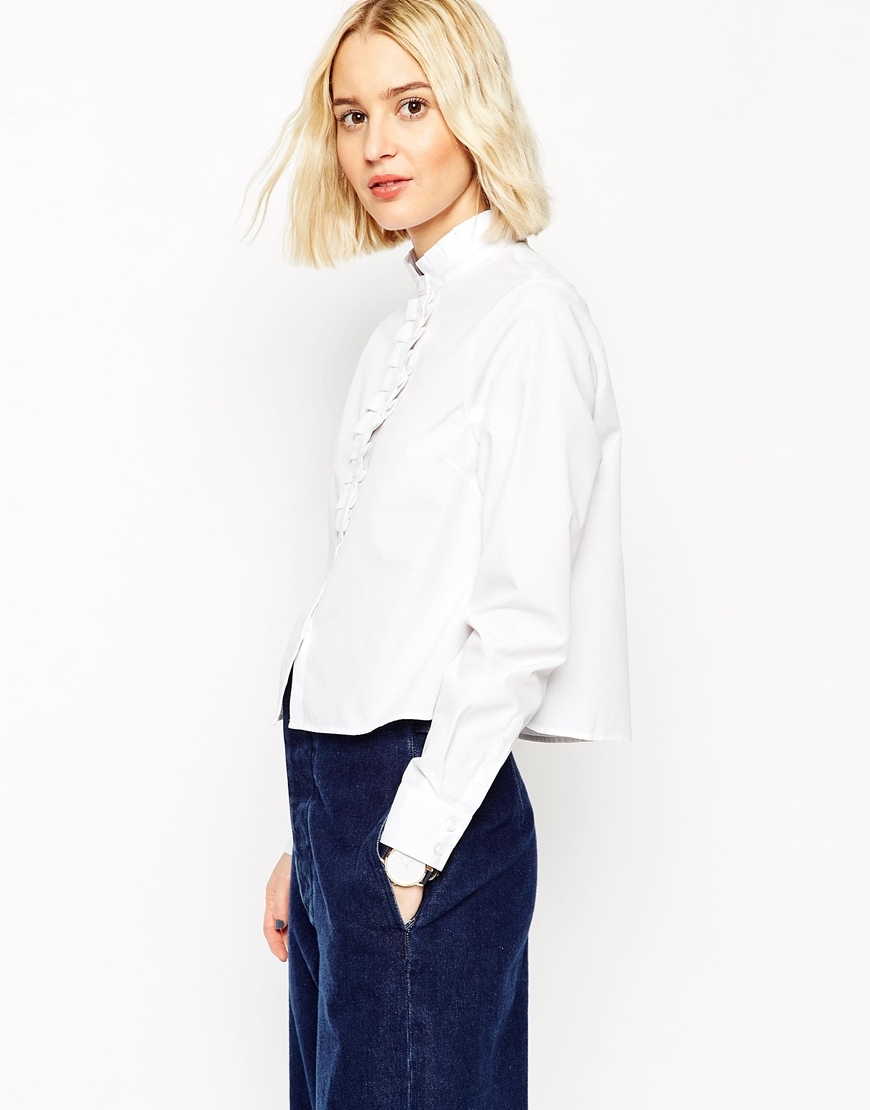 White Frill Neck Shirt With Frill Placket White - pattern: plain; style: shirt; bust detail: ruching/gathering/draping/layers/pintuck pleats at bust; predominant colour: white; occasions: casual, work, creative work; length: standard; neckline: collarstand; fibres: cotton - 100%; fit: straight cut; sleeve length: long sleeve; sleeve style: standard; pattern type: fabric; texture group: woven light midweight; season: a/w 2015