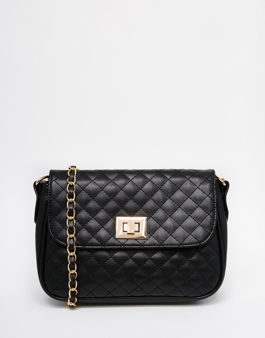 Quilted Lock Cross Body Bag Black - predominant colour: black; occasions: casual, creative work; type of pattern: standard; style: shoulder; length: across body/long; size: small; material: faux leather; embellishment: quilted; pattern: plain; finish: plain; season: a/w 2015