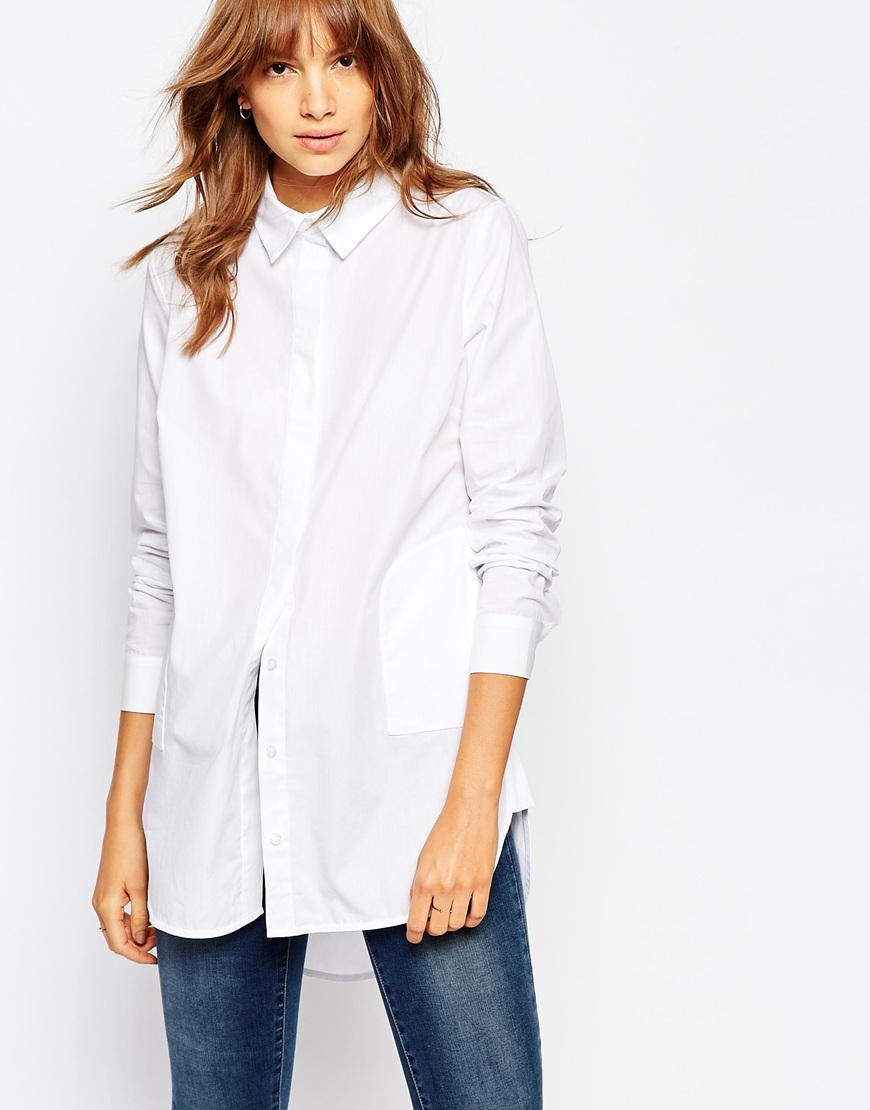 Longline Pocket Shirt White - neckline: shirt collar/peter pan/zip with opening; pattern: plain; length: below the bottom; style: shirt; predominant colour: white; occasions: casual, creative work; fibres: cotton - 100%; fit: body skimming; sleeve length: long sleeve; sleeve style: standard; texture group: cotton feel fabrics; pattern type: fabric; season: a/w 2015