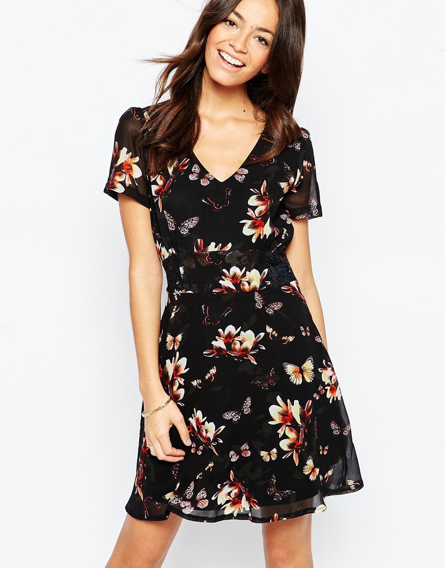 Tea Dress In Butterfly Floral Print Black - style: shift; neckline: v-neck; predominant colour: ivory/cream; secondary colour: black; occasions: casual, evening, creative work; length: just above the knee; fit: soft a-line; fibres: polyester/polyamide - 100%; sleeve length: short sleeve; sleeve style: standard; texture group: sheer fabrics/chiffon/organza etc.; pattern type: fabric; pattern size: big & busy; pattern: florals; multicoloured: multicoloured; season: a/w 2015