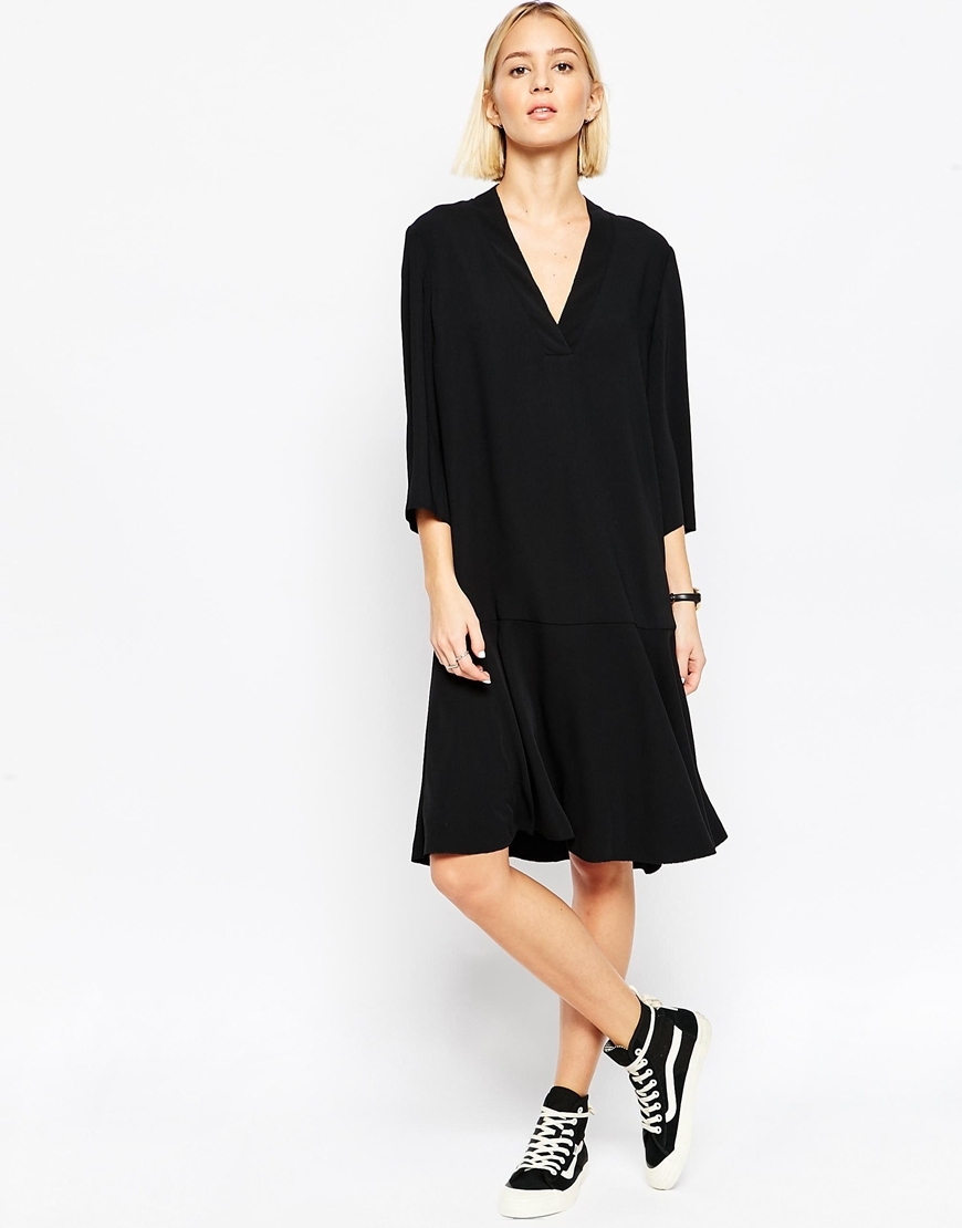 Flippy Skirt Midi Dress Black - style: shift; neckline: v-neck; fit: loose; pattern: plain; predominant colour: black; occasions: evening; length: on the knee; fibres: polyester/polyamide - 100%; sleeve length: 3/4 length; sleeve style: standard; pattern type: fabric; texture group: other - light to midweight; season: a/w 2015