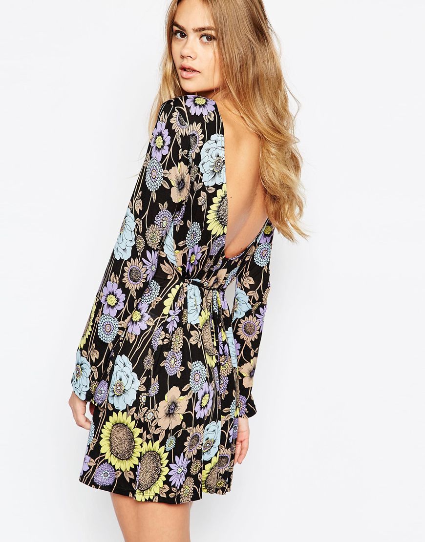 Flower Power Swing Dress With Plunge Back Multi - style: shift; back detail: low cut/open back; secondary colour: pale blue; predominant colour: black; occasions: evening; length: just above the knee; fit: body skimming; fibres: polyester/polyamide - stretch; neckline: crew; sleeve length: long sleeve; sleeve style: standard; pattern type: fabric; pattern: florals; texture group: jersey - stretchy/drapey; multicoloured: multicoloured; season: a/w 2015
