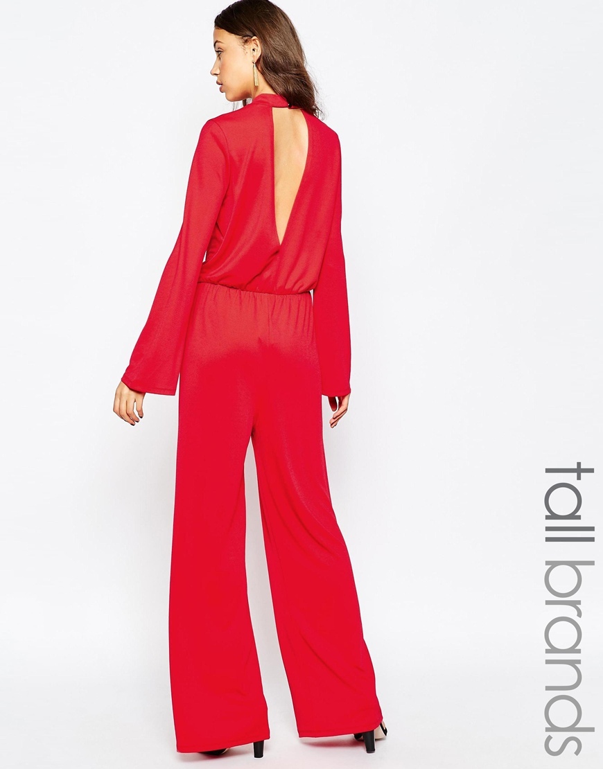 Tall Keyhole Back Wide Leg Jumpsuit Red - length: standard; fit: fitted at waist; pattern: plain; waist detail: elasticated waist; predominant colour: true red; fibres: polyester/polyamide - stretch; occasions: occasion; neckline: crew; sleeve length: long sleeve; sleeve style: standard; style: jumpsuit; pattern type: fabric; texture group: other - light to midweight; season: a/w 2015