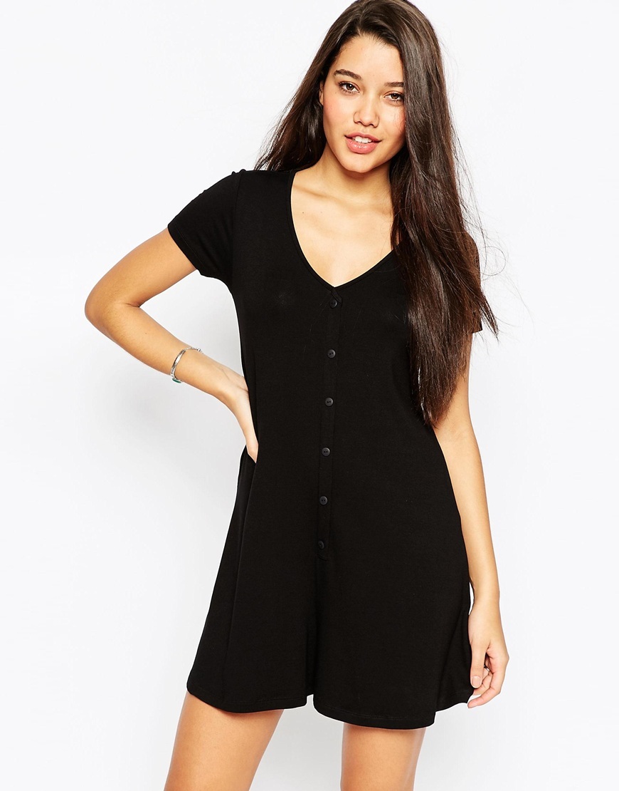 Jersey Button Front Swing Playsuit Black - neckline: v-neck; pattern: plain; length: short shorts; predominant colour: black; occasions: casual, holiday; fit: body skimming; fibres: viscose/rayon - stretch; sleeve length: short sleeve; sleeve style: standard; texture group: crepes; style: playsuit; pattern type: fabric; season: a/w 2015; wardrobe: holiday; embellishment location: bust