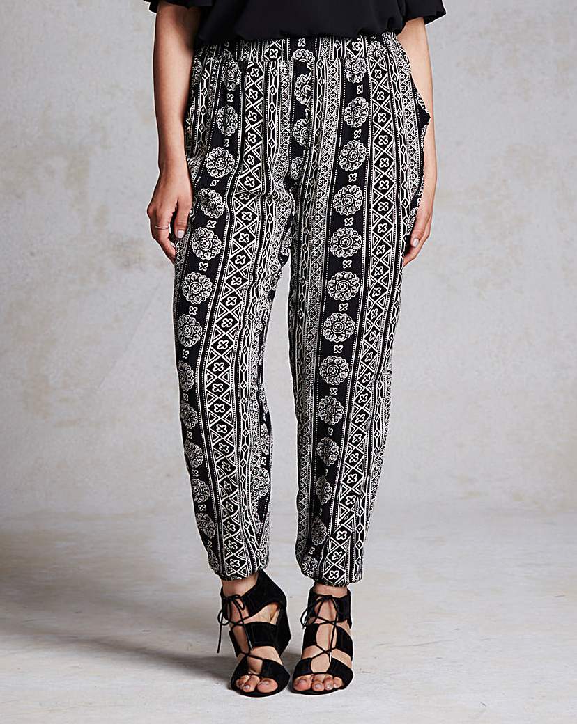 Crinkle Hareem Trousers - waist detail: elasticated waist; style: peg leg; pattern: paisley; waist: high rise; secondary colour: white; predominant colour: black; occasions: casual; length: ankle length; fibres: polyester/polyamide - 100%; trends: monochrome; fit: tapered; pattern type: fabric; texture group: woven light midweight; pattern size: standard (bottom); season: a/w 2015
