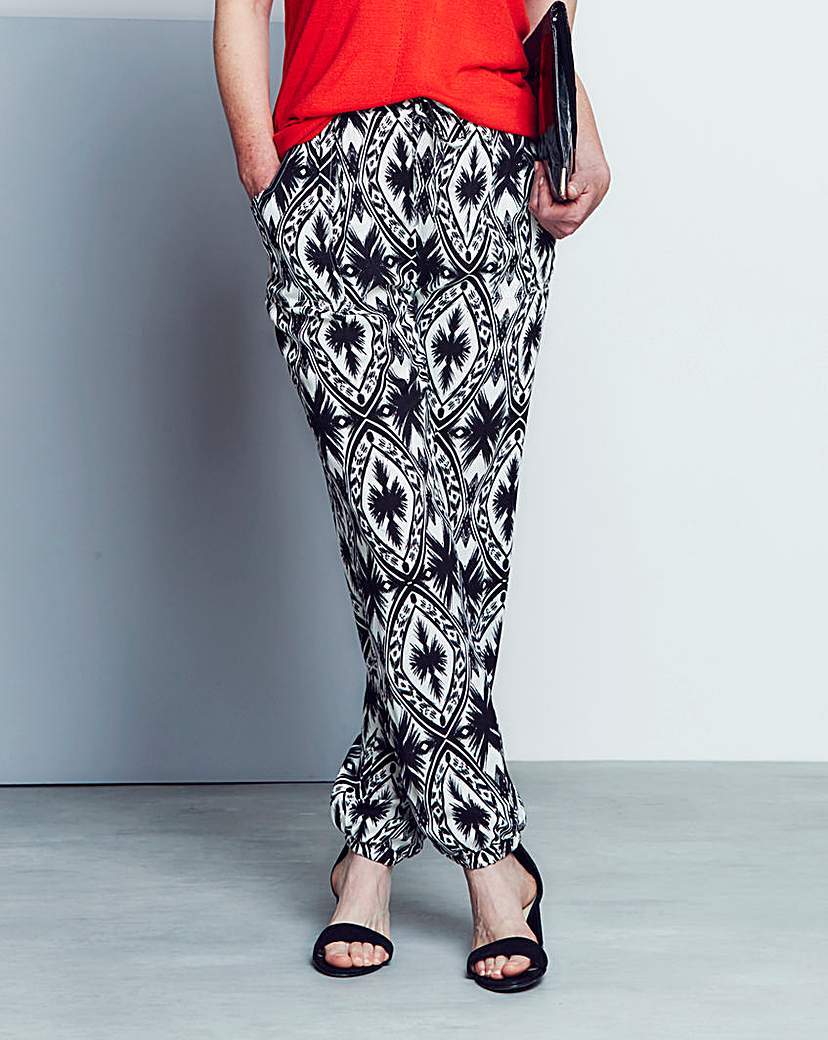 Printed Woven Harem Trousers Long - length: standard; pocket detail: pockets at the sides; waist detail: belted waist/tie at waist/drawstring; waist: mid/regular rise; secondary colour: white; predominant colour: black; occasions: casual; fibres: cotton - stretch; fit: slim leg; pattern type: fabric; pattern: patterned/print; texture group: woven light midweight; style: standard; season: a/w 2015