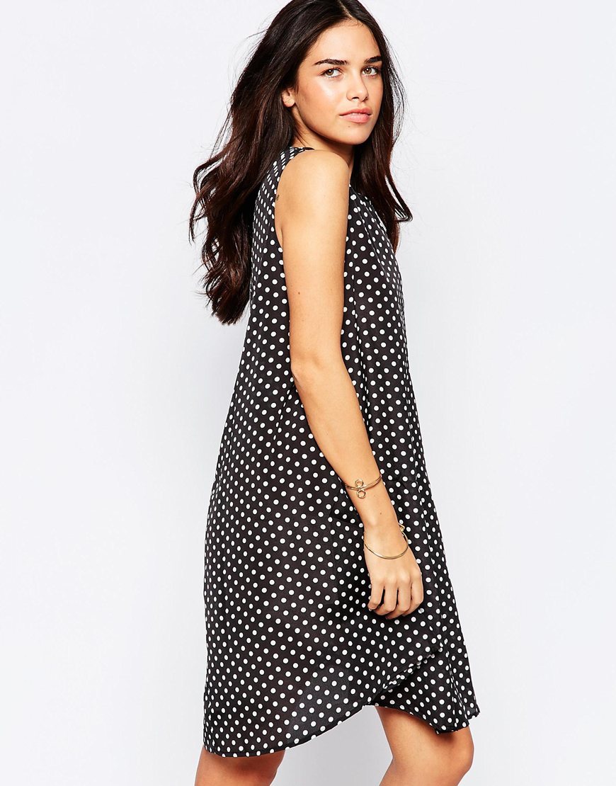 Swing Dress In Polka Dot Black/White Polka - sleeve style: sleeveless; secondary colour: white; predominant colour: black; occasions: casual; length: just above the knee; fit: soft a-line; style: asymmetric (hem); fibres: polyester/polyamide - 100%; neckline: crew; sleeve length: sleeveless; trends: monochrome; texture group: crepes; pattern type: fabric; pattern size: standard; pattern: patterned/print; season: a/w 2015