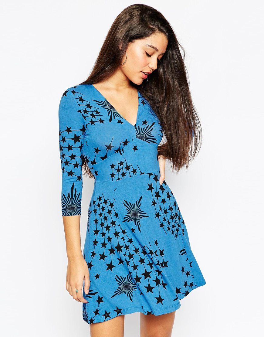 Star Print Skater Dress Blue - length: mid thigh; neckline: v-neck; predominant colour: diva blue; secondary colour: black; occasions: casual; fit: fitted at waist & bust; style: fit & flare; fibres: viscose/rayon - stretch; sleeve length: 3/4 length; sleeve style: standard; pattern type: fabric; pattern: patterned/print; texture group: jersey - stretchy/drapey; multicoloured: multicoloured; season: a/w 2015