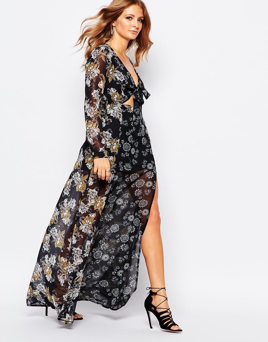Maxi Dress In 70s Floral Print 11025 Col - neckline: low v-neck; style: maxi dress; secondary colour: light grey; predominant colour: black; occasions: evening; length: floor length; fit: body skimming; fibres: polyester/polyamide - 100%; hip detail: slits at hip; waist detail: cut out detail; sleeve length: long sleeve; sleeve style: standard; pattern type: fabric; pattern size: big & busy; pattern: florals; texture group: other - light to midweight; multicoloured: multicoloured; season: a/w 2015