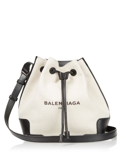 Canvas And Leather Bucket Bag - predominant colour: white; secondary colour: black; occasions: casual, creative work; type of pattern: light; style: onion bag; length: shoulder (tucks under arm); size: small; material: leather; embellishment: tassels; trends: monochrome; finish: plain; pattern: colourblock; season: s/s 2016; wardrobe: highlight