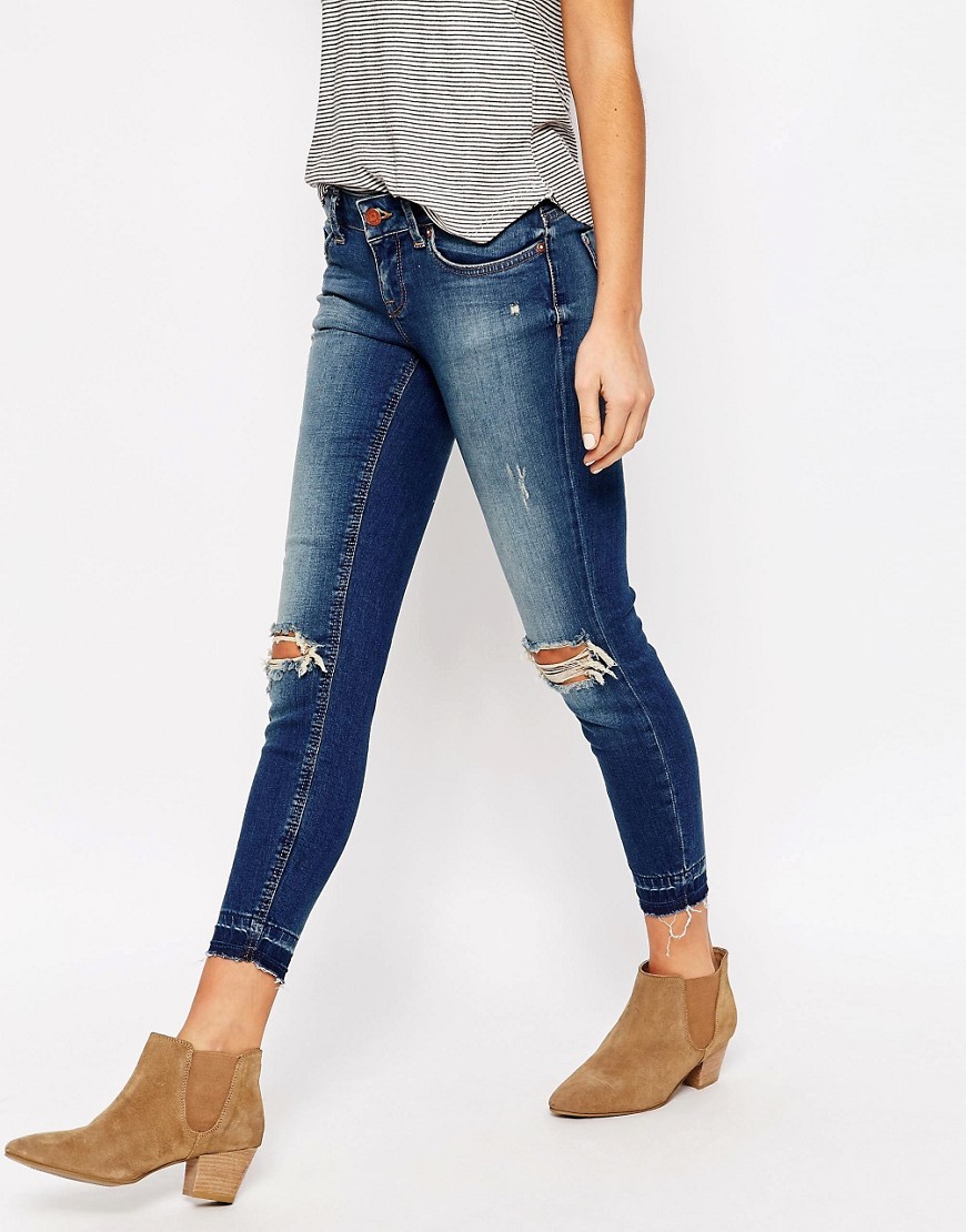 Coral Distressed Jeans 30 Leg Dark Blue Denim - style: skinny leg; length: standard; pattern: plain; pocket detail: traditional 5 pocket; waist: mid/regular rise; predominant colour: navy; occasions: casual; fibres: cotton - stretch; jeans detail: shading down centre of thigh, rips; texture group: denim; pattern type: fabric; season: s/s 2016; wardrobe: basic