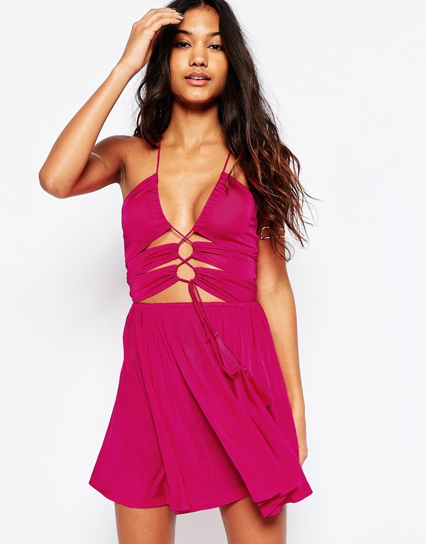 Slinky Jersey Lace Up Front Skater Beach Dress Pink - style: shift; length: mid thigh; neckline: v-neck; pattern: plain; sleeve style: sleeveless; predominant colour: hot pink; occasions: evening; fit: soft a-line; fibres: viscose/rayon - 100%; sleeve length: sleeveless; pattern type: fabric; texture group: other - light to midweight; season: s/s 2016; wardrobe: event