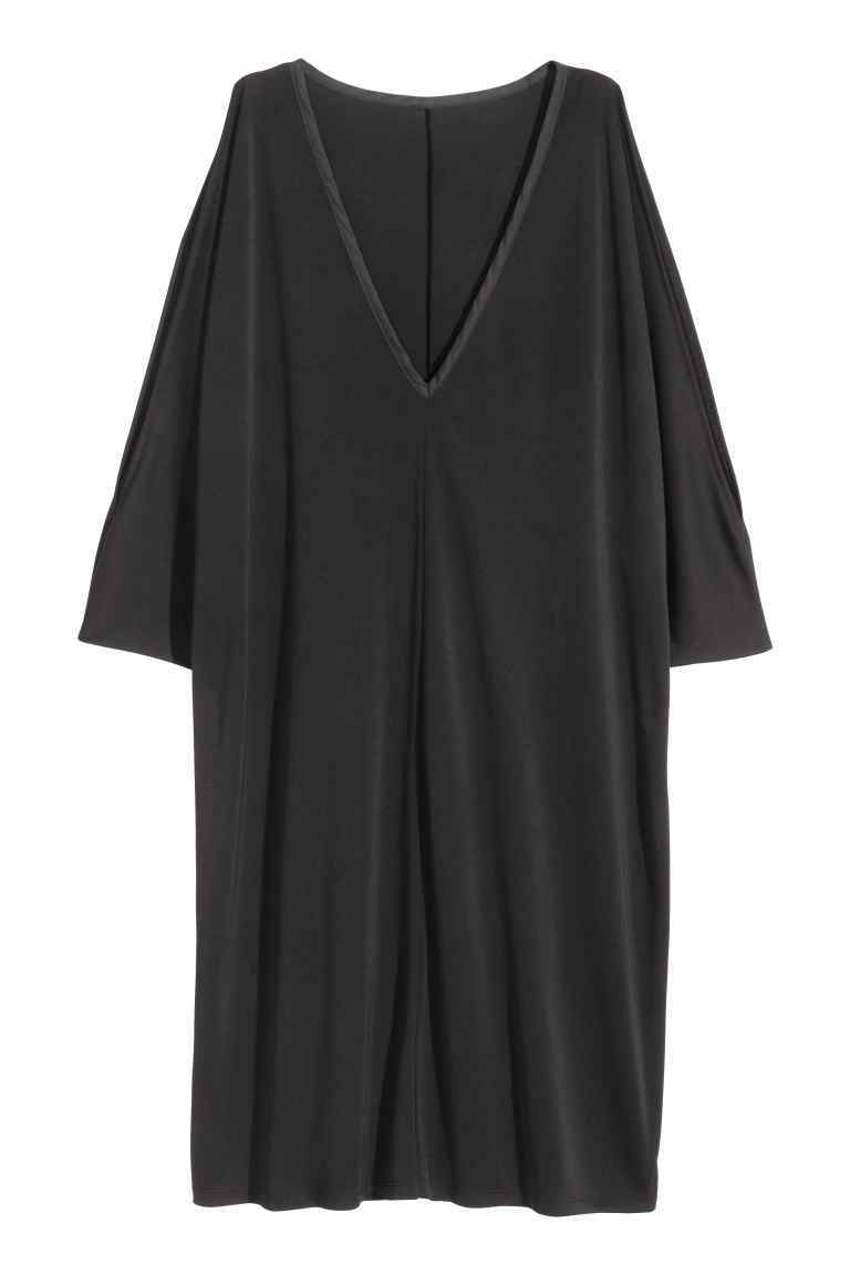 + Cold Shoulder Tunic - style: tunic; neckline: v-neck; pattern: plain; predominant colour: black; occasions: evening; length: just above the knee; fit: body skimming; fibres: polyester/polyamide - 100%; shoulder detail: cut out shoulder; sleeve length: 3/4 length; sleeve style: standard; pattern type: fabric; texture group: jersey - stretchy/drapey; season: s/s 2016; wardrobe: event
