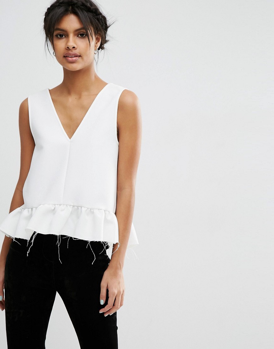Dip Hem Ruffle Vest With Raw Edge Cream - neckline: v-neck; pattern: plain; sleeve style: sleeveless; style: vest top; predominant colour: ivory/cream; occasions: evening; length: standard; fibres: polyester/polyamide - stretch; fit: body skimming; hip detail: adds bulk at the hips; sleeve length: sleeveless; pattern type: fabric; texture group: jersey - stretchy/drapey; season: s/s 2016; wardrobe: event