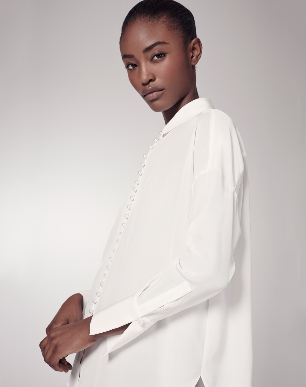 Oversized Silk Blouse - neckline: shirt collar/peter pan/zip with opening; pattern: plain; length: below the bottom; style: shirt; predominant colour: white; occasions: casual; fibres: silk - 100%; fit: loose; sleeve length: long sleeve; sleeve style: standard; texture group: silky - light; pattern type: fabric; season: s/s 2016; wardrobe: basic