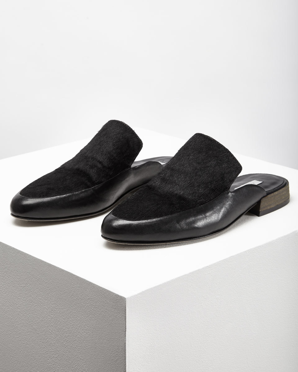 Gigi Loafer Mule - predominant colour: black; occasions: casual, creative work; material: leather; heel height: flat; toe: round toe; style: mules; finish: plain; pattern: plain; season: s/s 2016; wardrobe: highlight