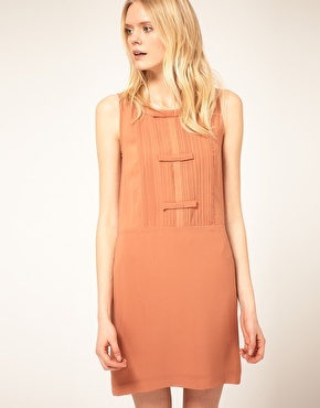 Bow Detail Dress With Pintucks - style: shift; length: mid thigh; pattern: plain; sleeve style: sleeveless; bust detail: added detail/embellishment at bust; neckline: roll neck; waist detail: belted waist/tie at waist/drawstring; predominant colour: terracotta; occasions: evening, work, occasion; fit: body skimming; trends: sixties; fibres: polyester/polyamide - 100%; material texture: chiffon; sleeve length: sleeveless; texture group: sheer fabrics/chiffon/organza etc.; pattern type: fabric; pattern size: standard