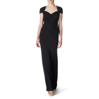 Open Back Gown - sleeve style: capped; pattern: plain; style: maxi dress; waist detail: fitted waist, twist front waist detail/nipped in at waist on one side/soft pleats/draping/ruching/gathering waist detail; neckline: sweetheart; shoulder detail: tiers/frills/ruffles; back detail: low cut/open back; bust detail: ruching/gathering/draping/layers/pintuck pleats at bust; predominant colour: black; occasions: evening, occasion; length: floor length; fit: body skimming; fibres: polyester/polyamide - stretch; material texture: jersey; sleeve length: short sleeve; pattern type: fabric; pattern size: standard; texture group: jersey - stretchy/drapey