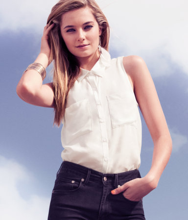 Blouse - neckline: shirt collar/peter pan/zip with opening; pattern: plain; sleeve style: sleeveless; bust detail: added detail/embellishment at bust, buttons at bust (in middle at breastbone)/zip detail at bust; style: blouse; predominant colour: ivory; occasions: casual, evening, work; length: standard; fibres: polyester/polyamide - stretch; material texture: chiffon; fit: body skimming; trends: white; sleeve length: sleeveless; texture group: sheer fabrics/chiffon/organza etc.; pattern type: fabric; pattern size: standard