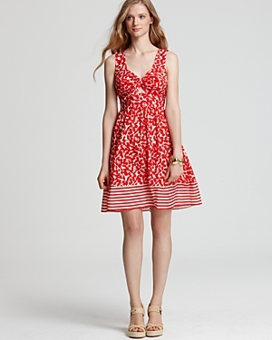 Swimwear Cherry Print Bow Dress - fit: fitted at waist; pattern: floral - busy, print, florals, patterned/print; sleeve style: sleeveless; style: full skirt; waist detail: fitted waist, wide waistband/cummerbund, twist front waist detail/nipped in at waist on one side/soft pleats/draping/ruching/gathering waist detail, narrow waistband; back detail: low cut/open back; bust detail: ruching/gathering/draping/layers/pintuck pleats at bust, knot twist front detail at bust; predominant colour: true red; occasions: casual, occasion; length: just above the knee; neckline: peep hole neckline; fibres: cotton - mix; material texture: chiffon; hip detail: structured pleats at hip; trends: prints; sleeve length: sleeveless; texture group: sheer fabrics/chiffon/organza etc.; pattern type: fabric; pattern size: standard