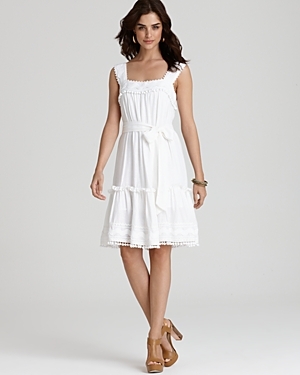 Matira Ric Rac Dress - neckline: high square neck; sleeve style: sleeveless; style: sundress; waist detail: fitted waist, belted waist/tie at waist/drawstring; shoulder detail: contrast pattern/fabric at shoulder; bust detail: ruching/gathering/draping/layers/pintuck pleats at bust, contrast pattern/fabric/detail at bust; predominant colour: white; occasions: casual; length: on the knee; fit: body skimming; fibres: viscose/rayon - stretch; material texture: calico; hip detail: ruching/gathering at hip, soft pleats at hip/draping at hip/flared at hip; trends: white; sleeve length: sleeveless; texture group: cotton feel fabrics; pattern type: fabric; pattern size: small & light; embellishment: embroidered