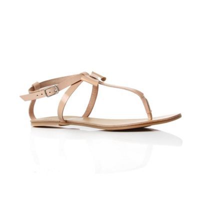Nude Peyton Flip Flops & Sandals - predominant colour: nude; material: leather; heel height: flat; embellishment: buckles, ribbon; ankle detail: ankle strap; heel: standard; toe: open toe/peeptoe; style: flip flops / toe post