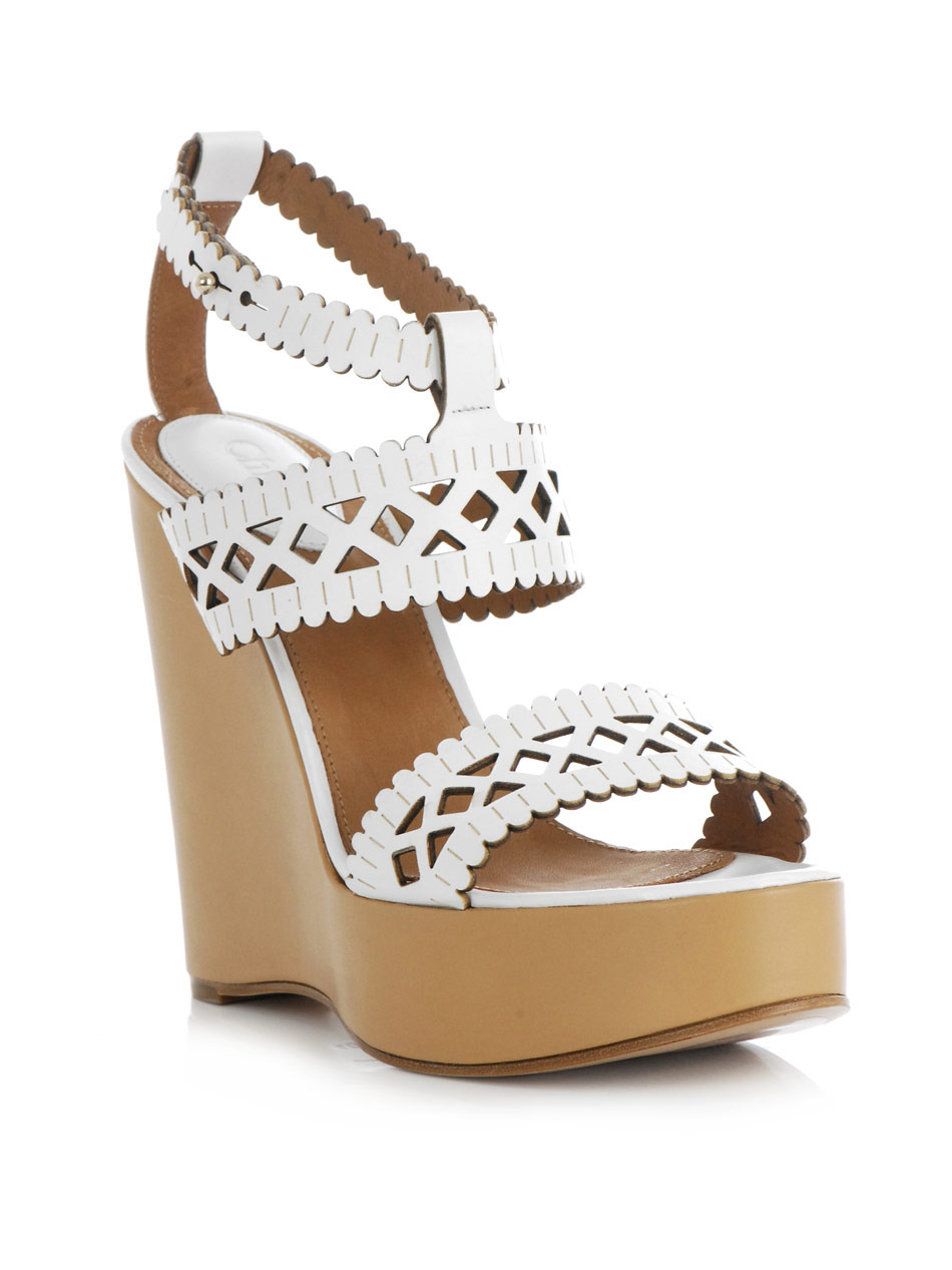Laser Cut Leather Wedge Shoes - predominant colour: white; material: leather; heel height: high; embellishment: embroidered; ankle detail: ankle strap; heel: wedge; toe: open toe/peeptoe; style: strappy
