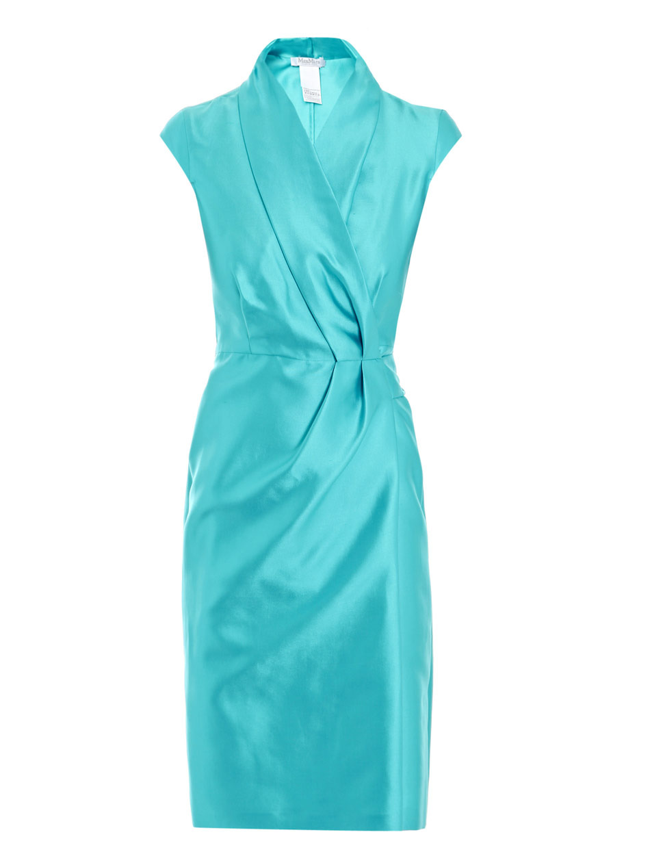 Azalea Dress - style: shift; sleeve style: capped; fit: tailored/fitted; pattern: plain; neckline: shawl; waist detail: fitted waist, twist front waist detail/nipped in at waist on one side/soft pleats/draping/ruching/gathering waist detail; back detail: tie detail at back; bust detail: ruching/gathering/draping/layers/pintuck pleats at bust; predominant colour: turquoise; occasions: evening, occasion; length: on the knee; fibres: silk - mix; material texture: chiffon; hip detail: soft pleats at hip/draping at hip/flared at hip; trends: aquatic, brights; sleeve length: short sleeve; texture group: sheer fabrics/chiffon/organza etc.; pattern type: fabric; pattern size: standard