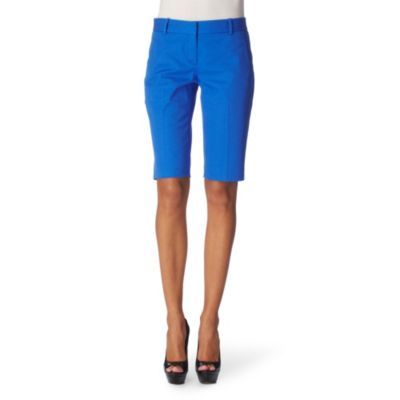 Yanera Shorts - style: shorts; waist detail: fitted waist, narrow waistband; pocket detail: small back pockets, pockets at the sides; waist: mid/regular rise; predominant colour: royal blue; occasions: casual, work; length: on the knee; fibres: cotton - mix; material texture: calico; hip detail: fitted at hip (bottoms); trends: aquatic, brights; texture group: cotton feel fabrics; fit: slim leg