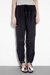 Silk Zip Sweatpants - style: tracksuit pants; waist detail: elasticated waist, belted waist/tie at waist/drawstring; pocket detail: small back pockets, pockets at the sides; waist: low rise; predominant colour: black; occasions: casual, evening, work; length: ankle length; fibres: silk - 100%; hip detail: front pleats at hip level, fitted at hip (bottoms); material texture: silky; trends: aquatic, sports luxe; texture group: silky - light; fit: baggy