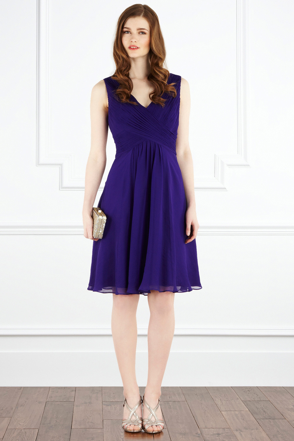 Almondo Dress - style: shift; neckline: v-neck; pattern: plain; sleeve style: sleeveless; waist detail: fitted waist; back detail: low cut/open back; bust detail: ruching/gathering/draping/layers/pintuck pleats at bust; predominant colour: purple; occasions: evening, occasion; length: on the knee; fit: body skimming; fibres: silk - 100%; material texture: chiffon; hip detail: ruching/gathering at hip, soft pleats at hip/draping at hip/flared at hip; trends: aquatic; sleeve length: sleeveless; texture group: sheer fabrics/chiffon/organza etc.; pattern type: fabric; pattern size: standard