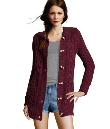 Cardigan - neckline: v-neck; style: chunky knit; back detail: hood; hip detail: front pockets at hip; pattern: cable knit; predominant colour: burgundy; occasions: casual; fibres: acrylic - mix; material texture: jersey; fit: standard fit; length: mid thigh; sleeve length: long sleeve; sleeve style: standard; pattern type: knitted - other; pattern size: standard; texture group: jersey - stretchy/drapey