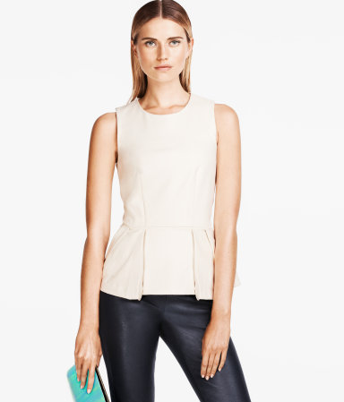 Top - neckline: round neck; pattern: plain; sleeve style: sleeveless; waist detail: peplum waist detail; predominant colour: ivory/cream; occasions: casual, evening, work; length: standard; style: top; fibres: polyester/polyamide - mix; fit: body skimming; sleeve length: sleeveless; texture group: crepes; pattern type: fabric; season: s/s 2013