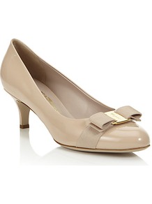 Carla 55mm Patent Pump - predominant colour: stone; occasions: evening, work, occasion; material: leather; heel height: mid; heel: kitten; toe: round toe; style: courts; finish: patent; pattern: plain; embellishment: bow